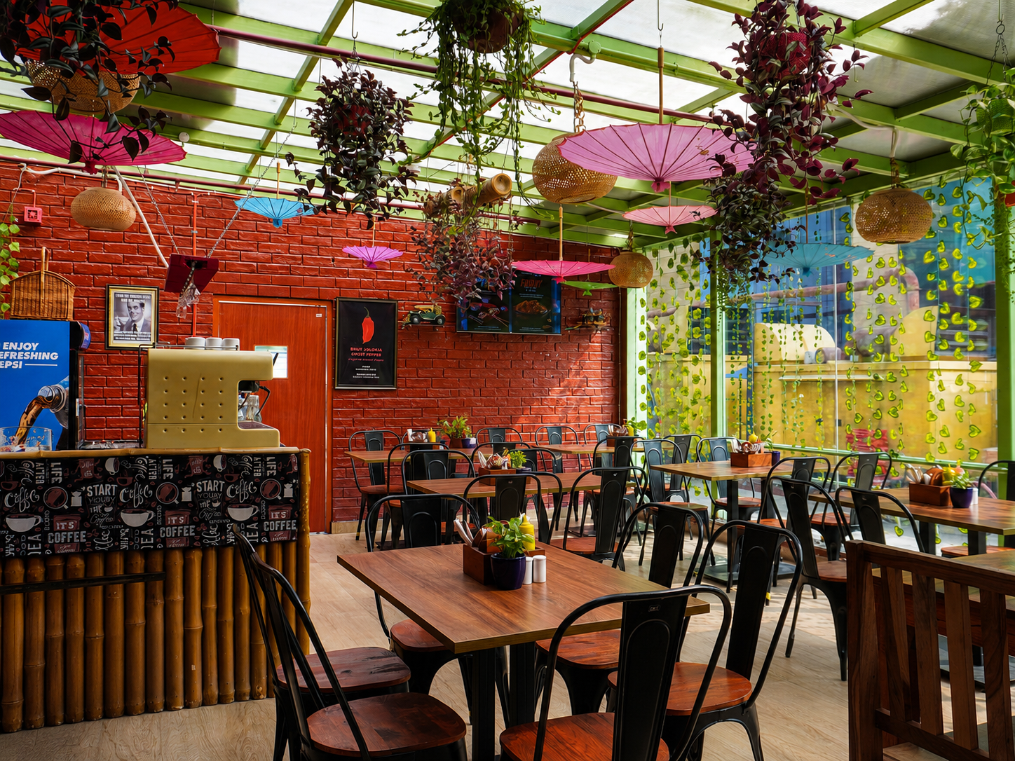 Brick-walled dining area with pink umbrellas and hanging plants