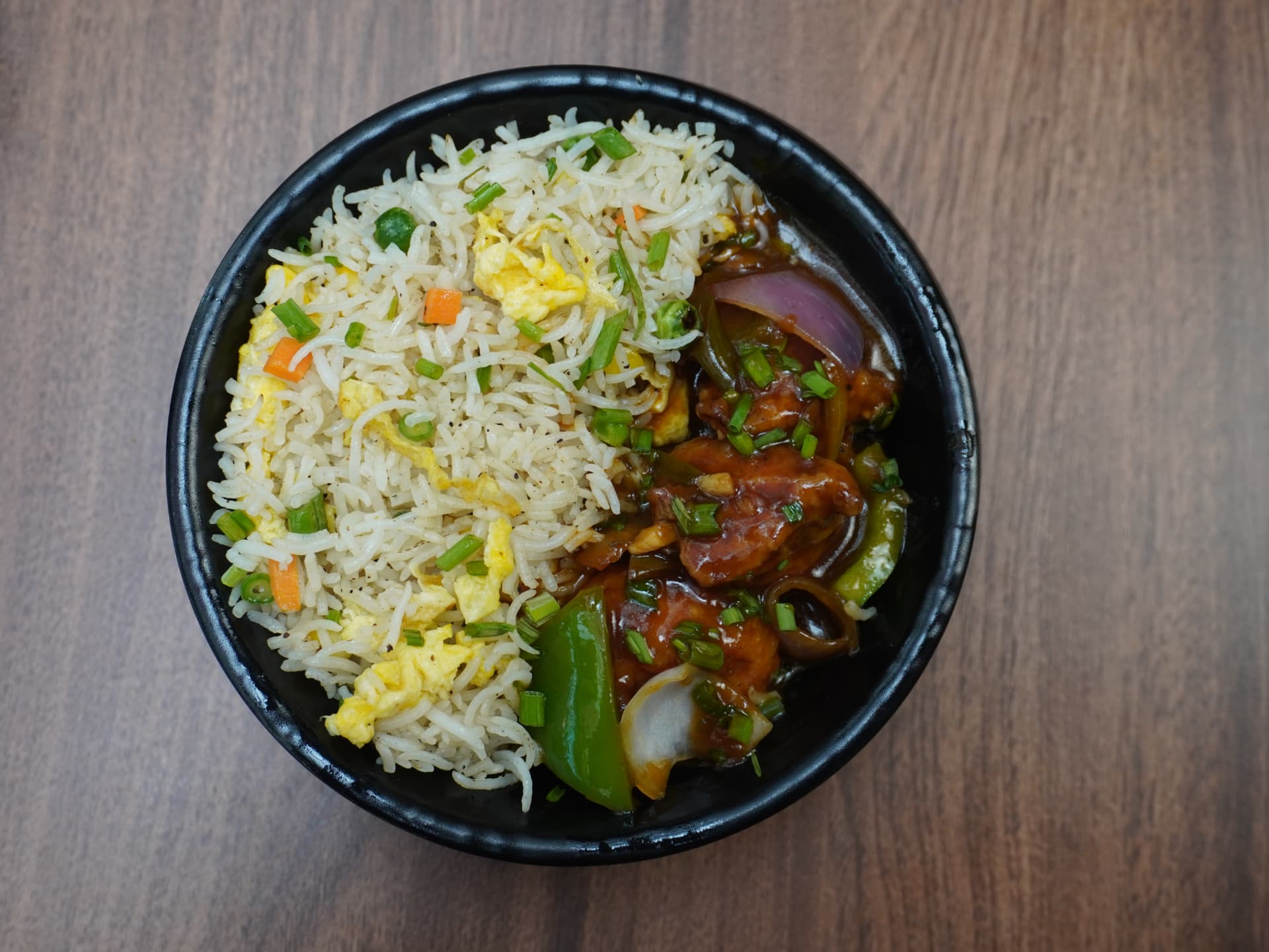 Egg fried rice bowl with chilli chicken
