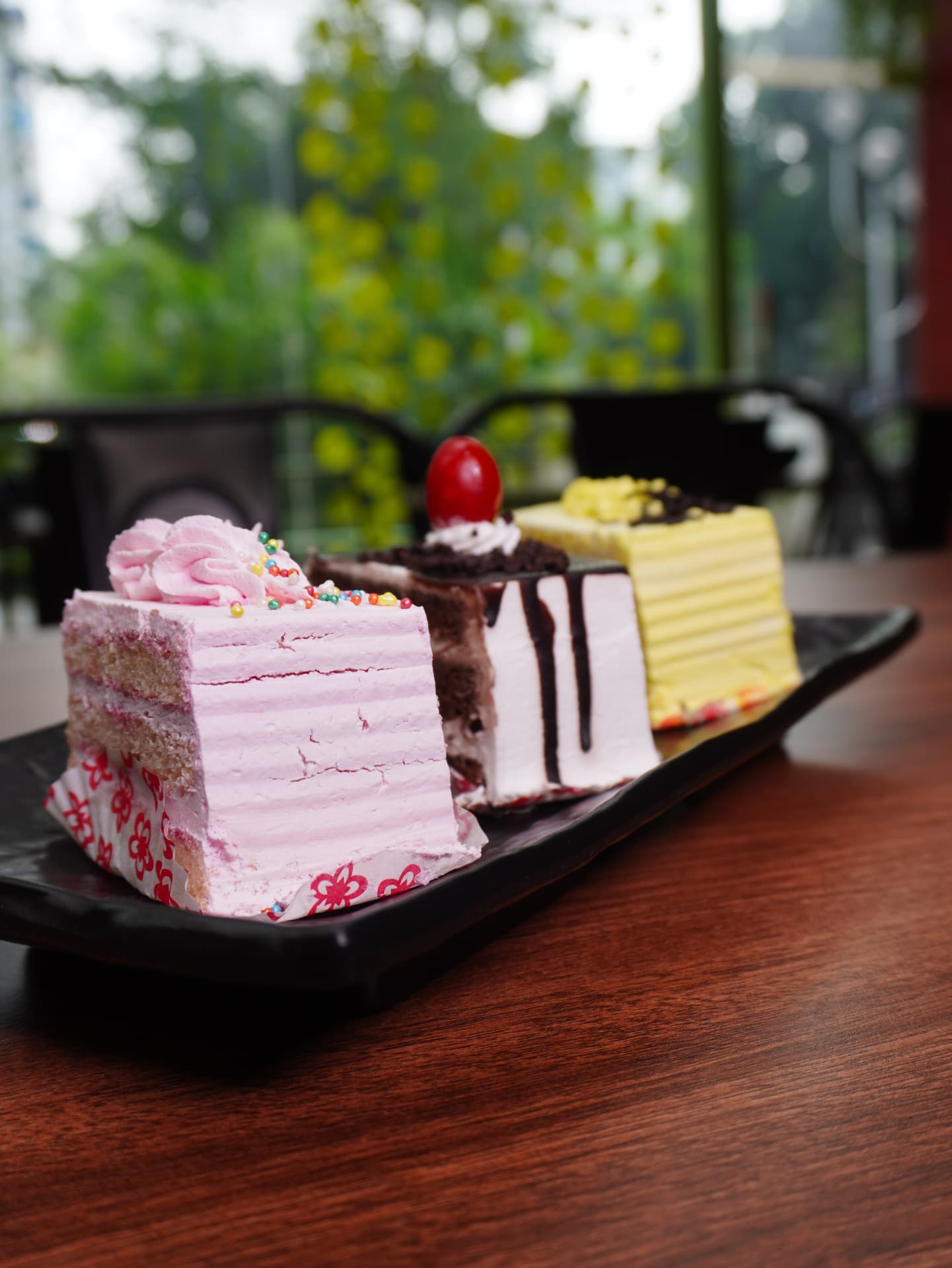 Assorted cake slices — strawberry, chocolate and butterscotch