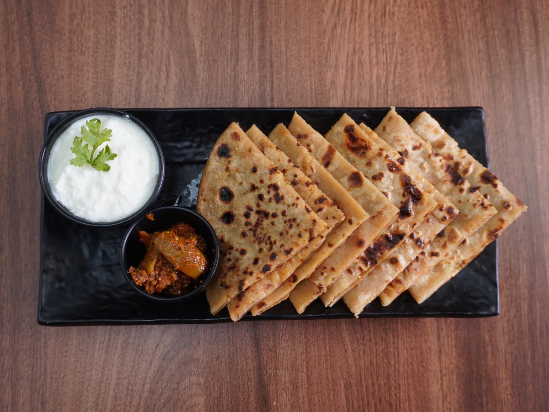Stuffed parathas with curd and pickle